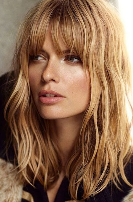 4. Mid-Length Cut with Bangs