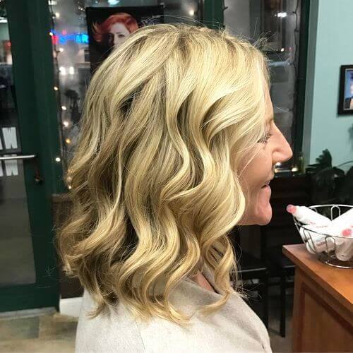 Elegant Curly Medium Length Haircut for Women over 50