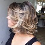 over-50-mid-length-curly-haircut-with-bangs