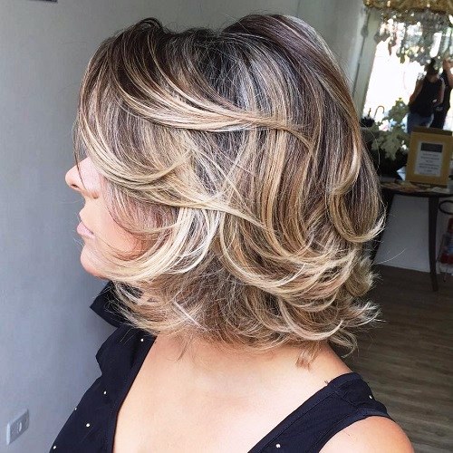 Over 50 Mid-Length Curly Haircut with Bangs