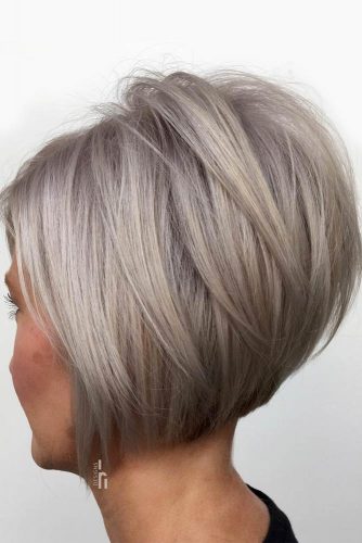 Silver Inverted Bob With Overlapping Long Layers #shortbob #shortbobhairstyles #hairstyles #bobhairstyles #silverhair