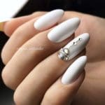 glamorous-white-nails-design-with-a-half-moon-acce