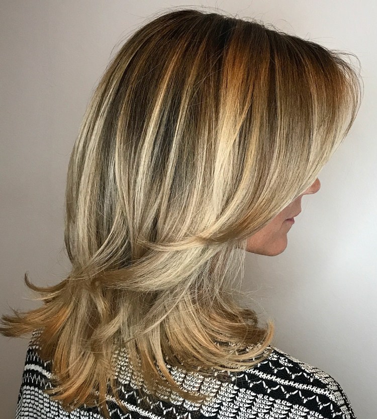 Medium Blonde Hairstyle with Flicked Ends