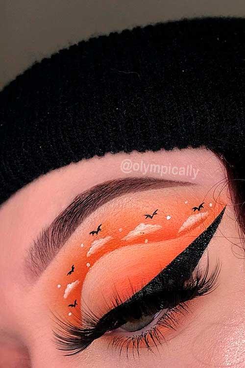The Orange Spooky Skies Eye Makeup Look for Halloween 2021