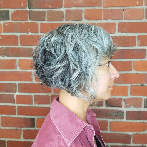A graduated short angled bob haircut for for older women with grey hair
