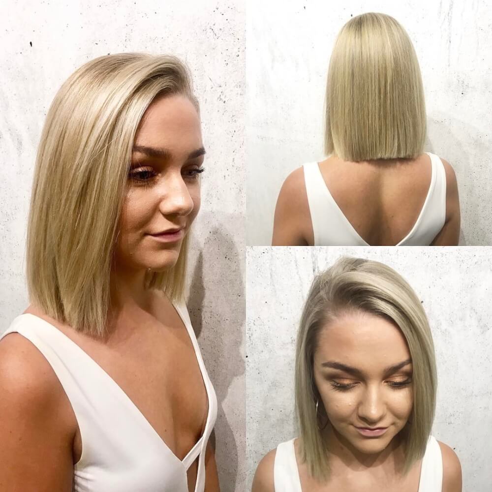 A short one length bob haircut and blonde color
