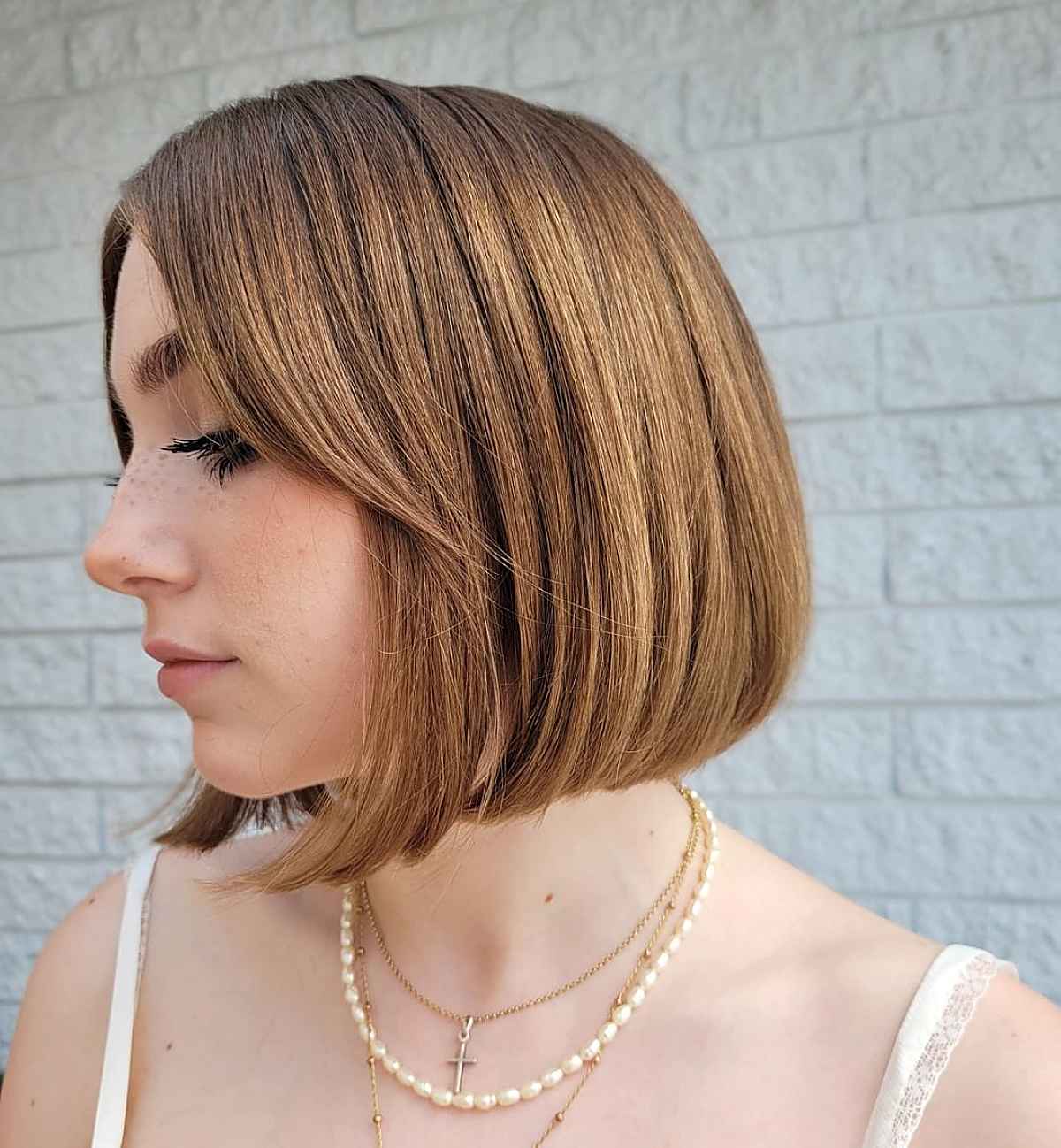 chin-length bob with curtain bangs