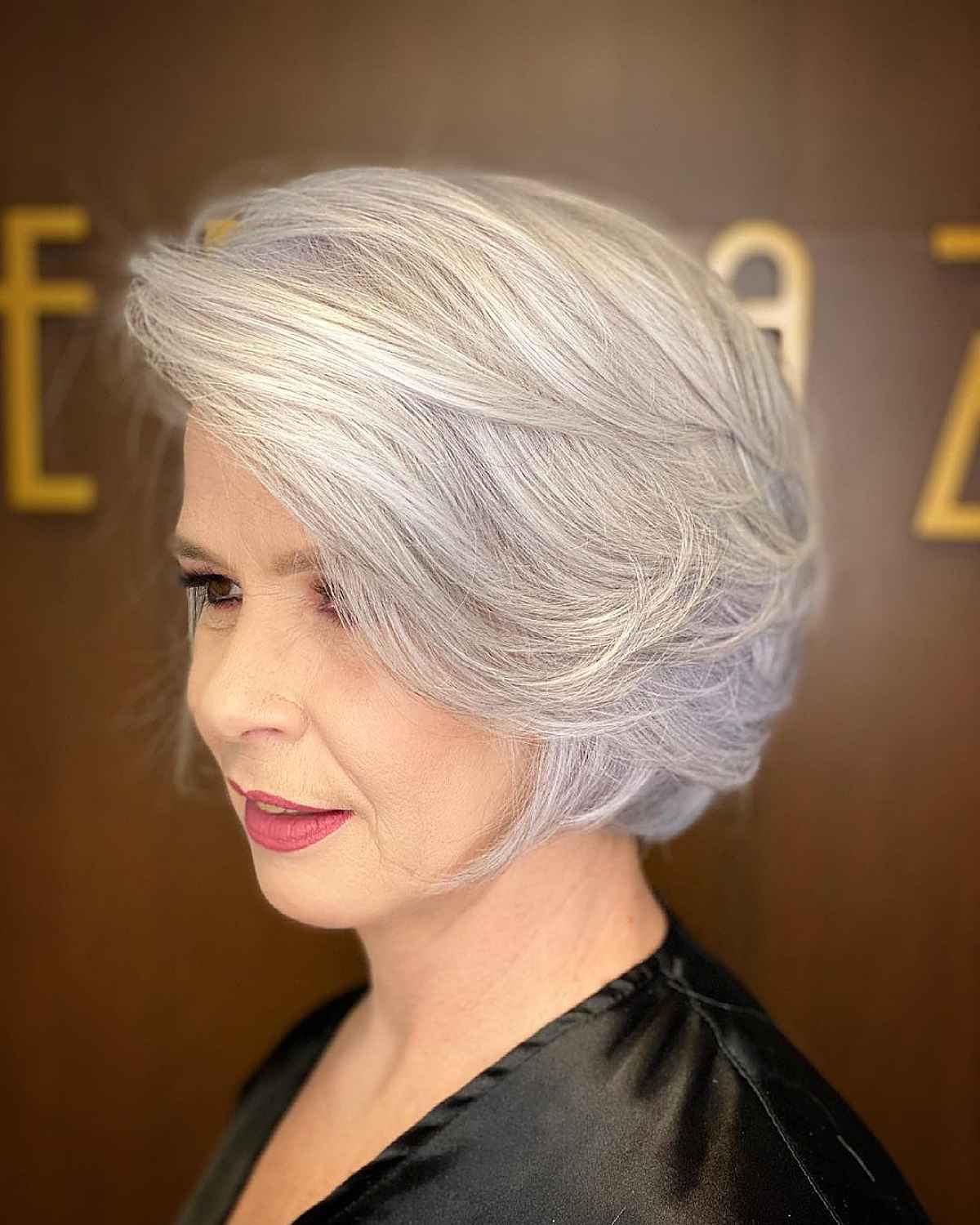 Jaw-Length Feathered Bob with Bangs for Older Women