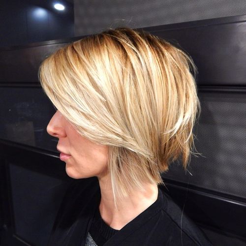 blonde angled shaggy bob with side bangs