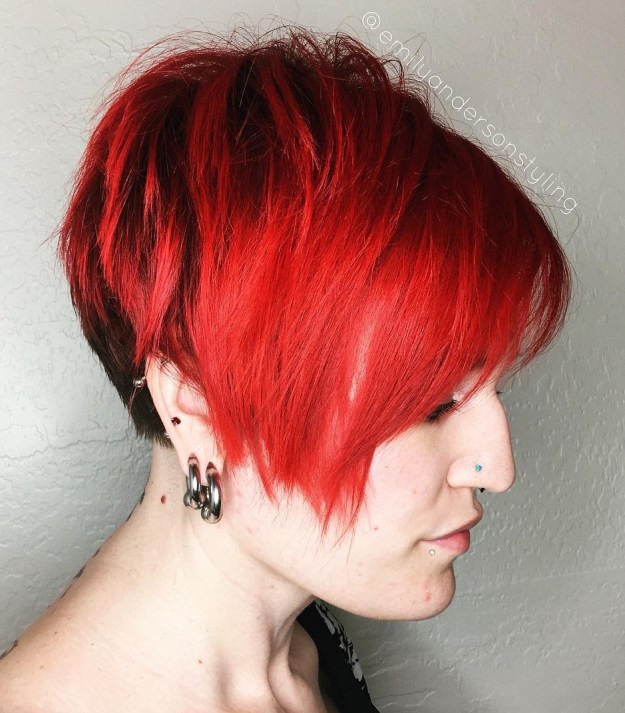 bright red asymmetrical pixie with side bangs