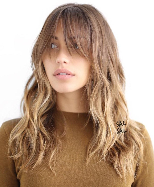 Light Brown Layered Hairstyle With Bangs