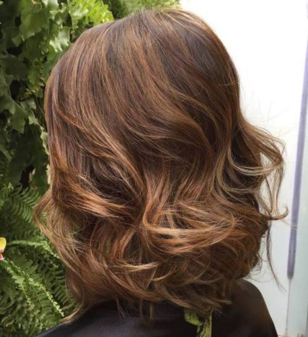 long curled brown bob with subtle highlights