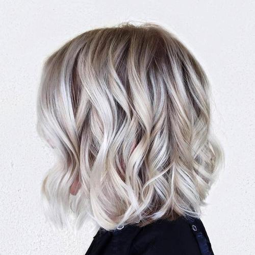 loosely curled blonde lob hairstyle