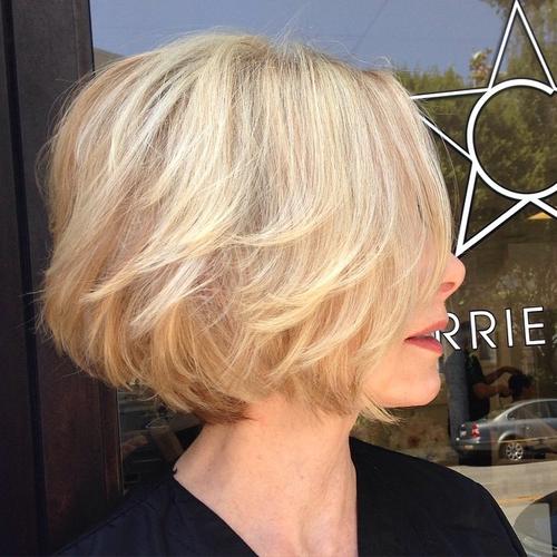 short wavy strawberry blonde bob