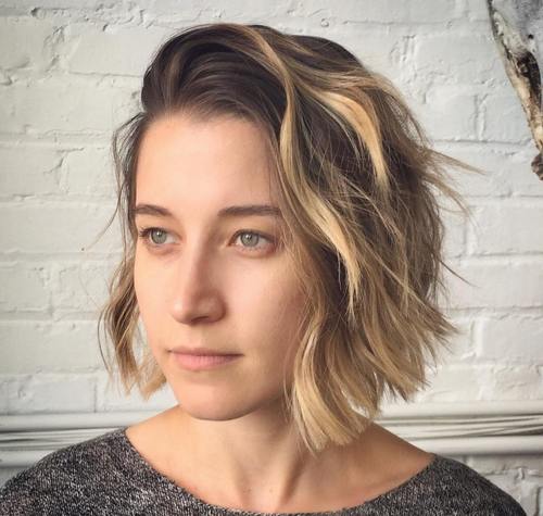 side-swept wavy bob with highlights