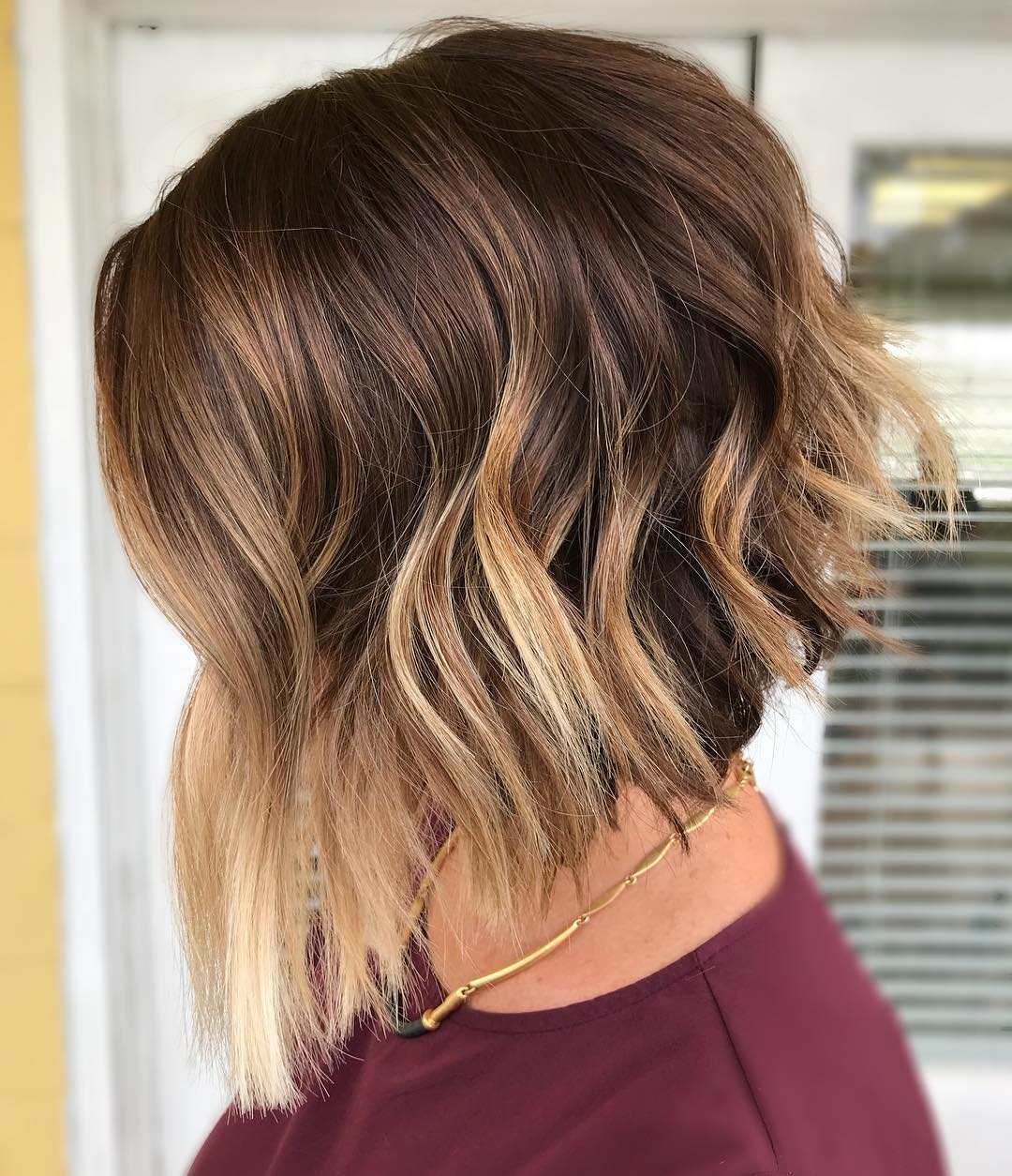 Angled Warm Brown Bob With Blonde Highlights