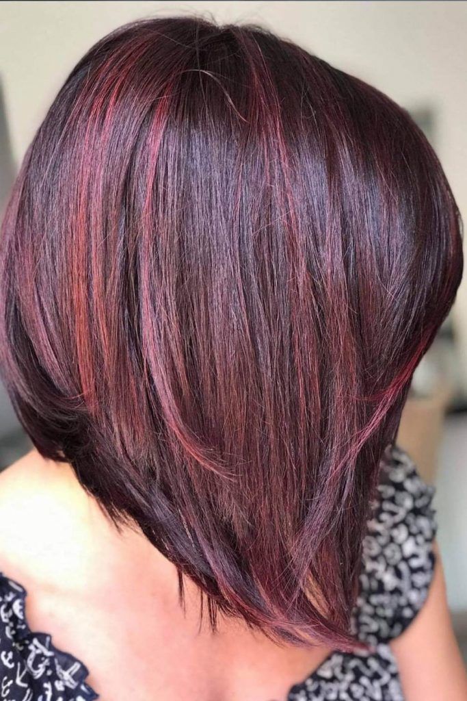 Angled Bob Haircut With Cherry Highlights