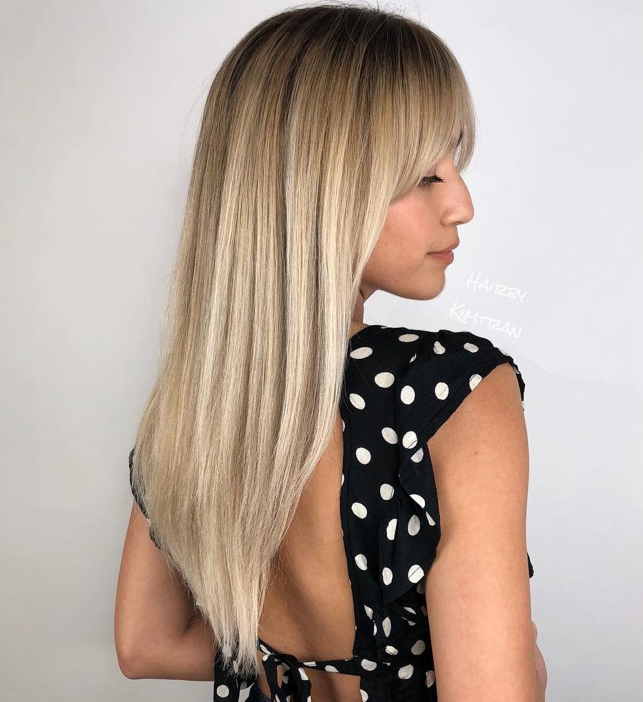 Blonde V-Cut Hairstyle With Curtain Bangs