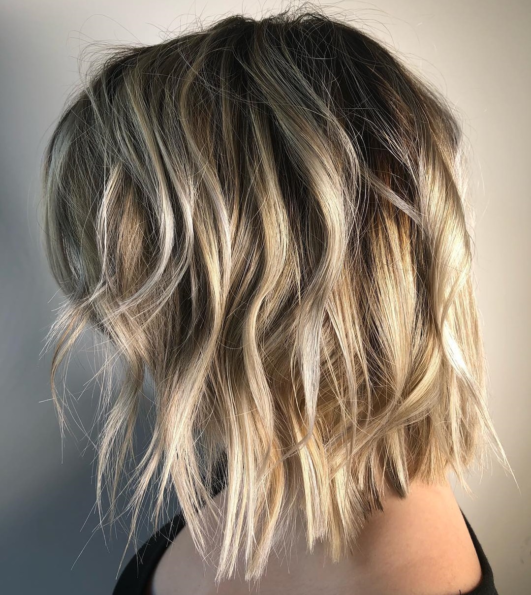 Choppy Blonde Bob With Shadow Roots