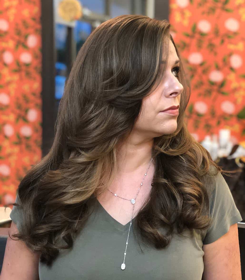 Face-Framing Layers And Side Bangs For Thick Hair