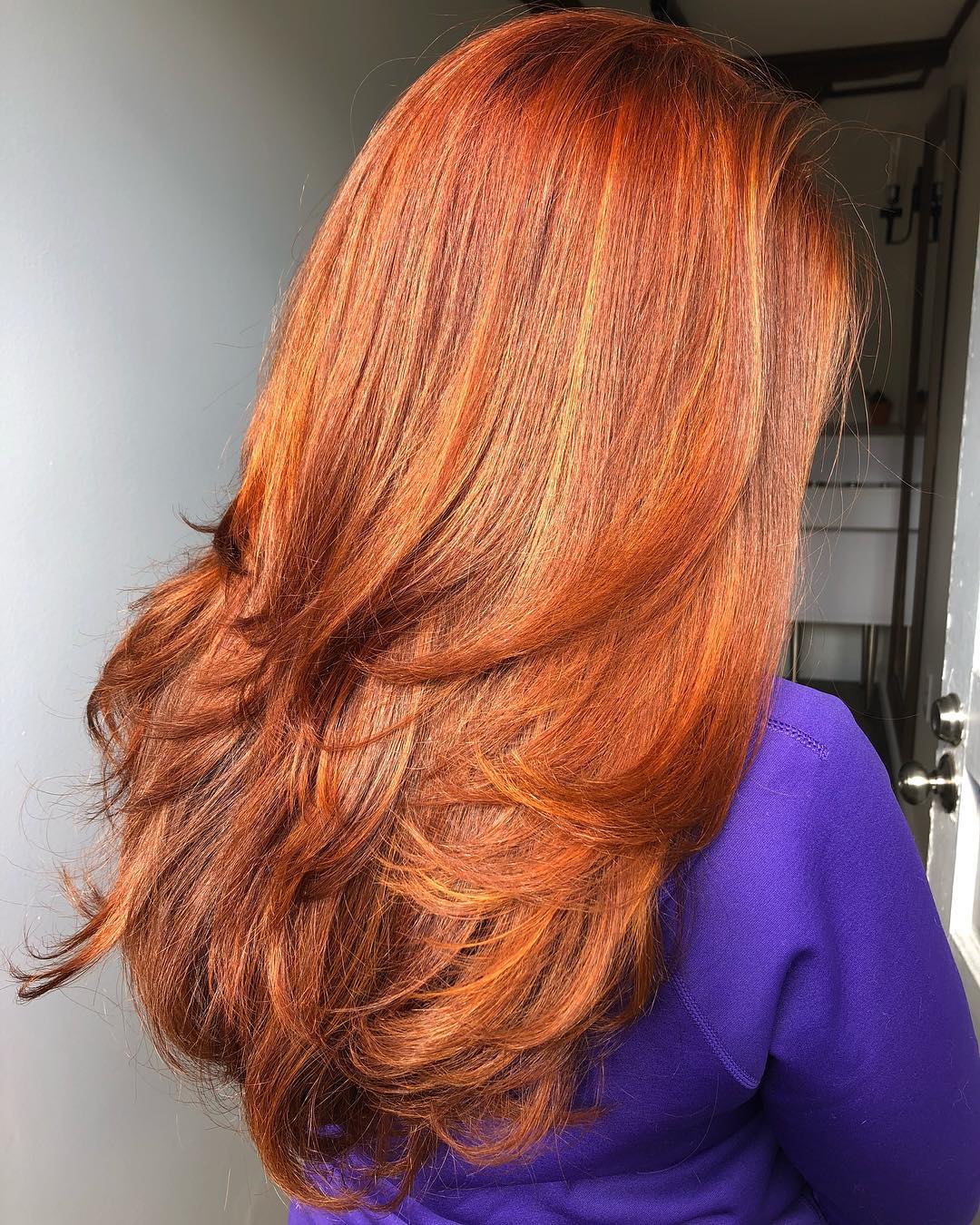 Feathered Red Hairstyle For Thick Hair