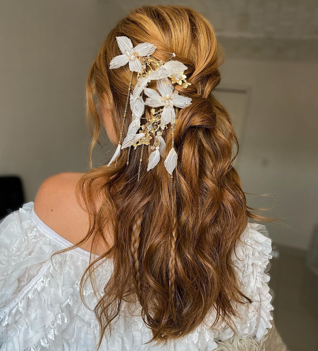 Half Up Half Down Wedding Hairstyle with Floral Hair Decor