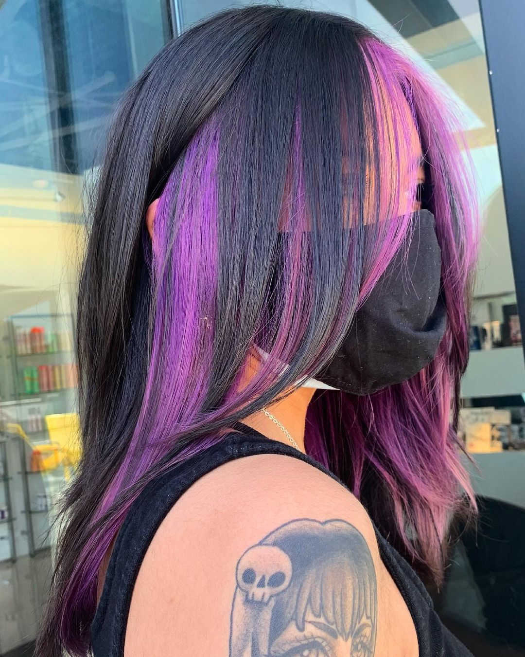 Layered Haircut with Purple Peekaboo Highlights