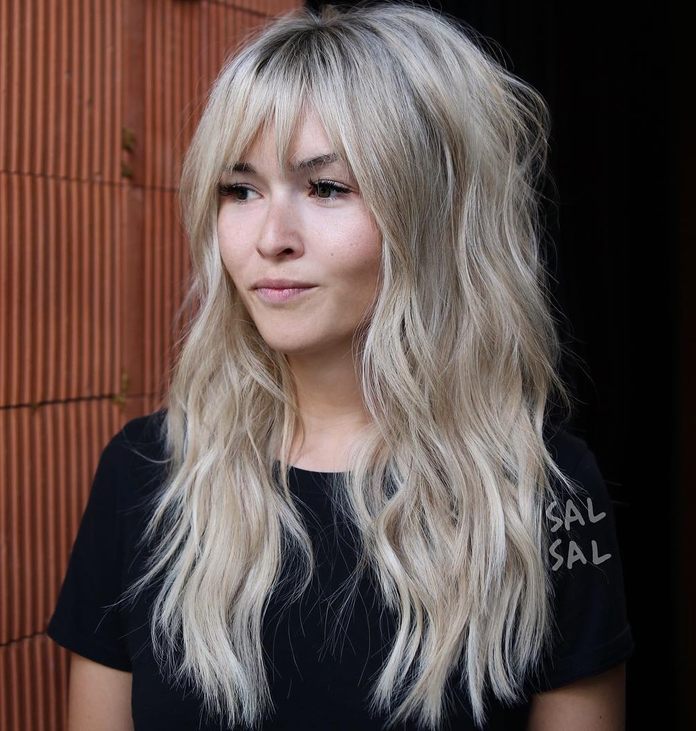 Long Blonde Shaggy Hairstyle With A Fringe