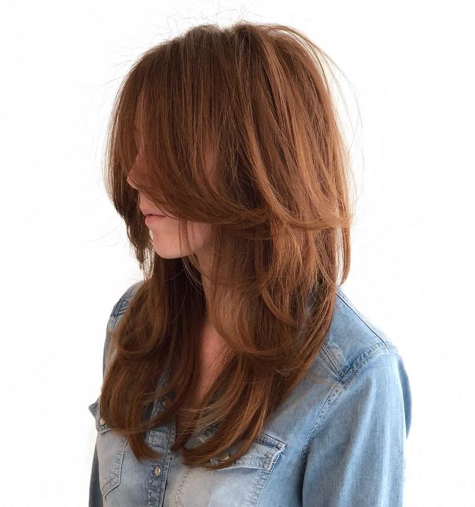 Long Hairstyle With Layers And Face-Framing Bangs