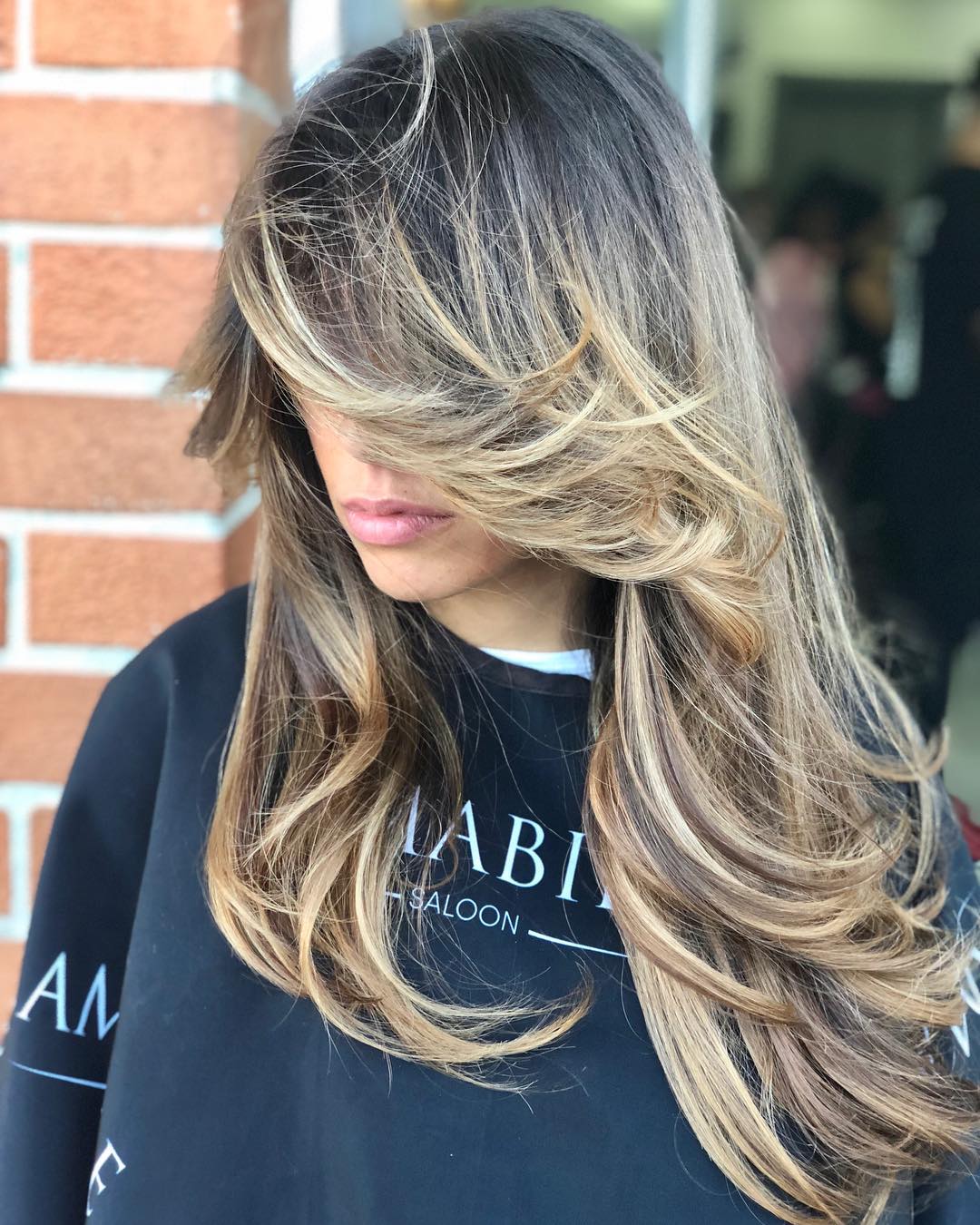Long Layered Bronde Hairstyle With Bangs