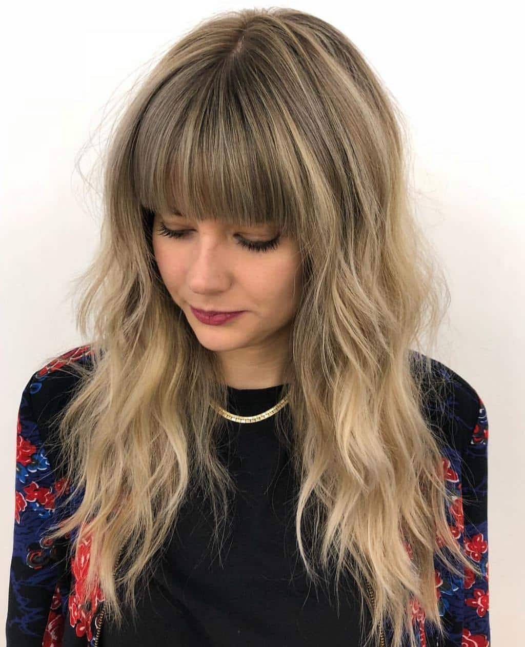 Long Layered Hairstyle With A Blunt Fringe