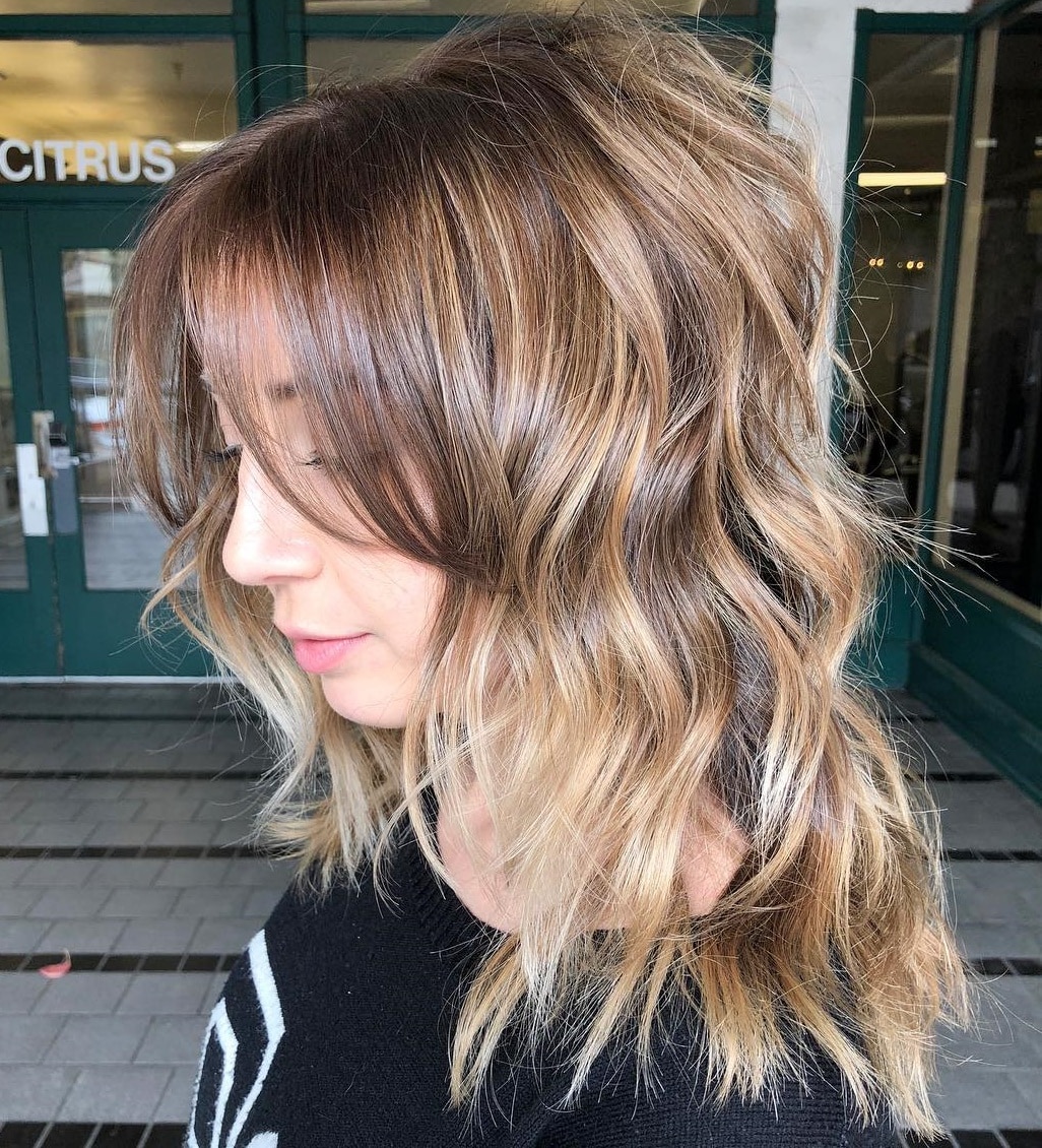 Medium Layered Hairstyle With Wispy Bangs