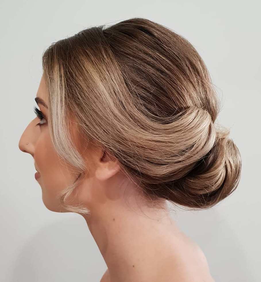 Sleek Rolled Updo For Fine Hair