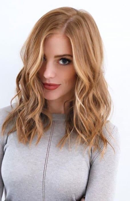 Strawberry Blonde Hair With Wavy Lob