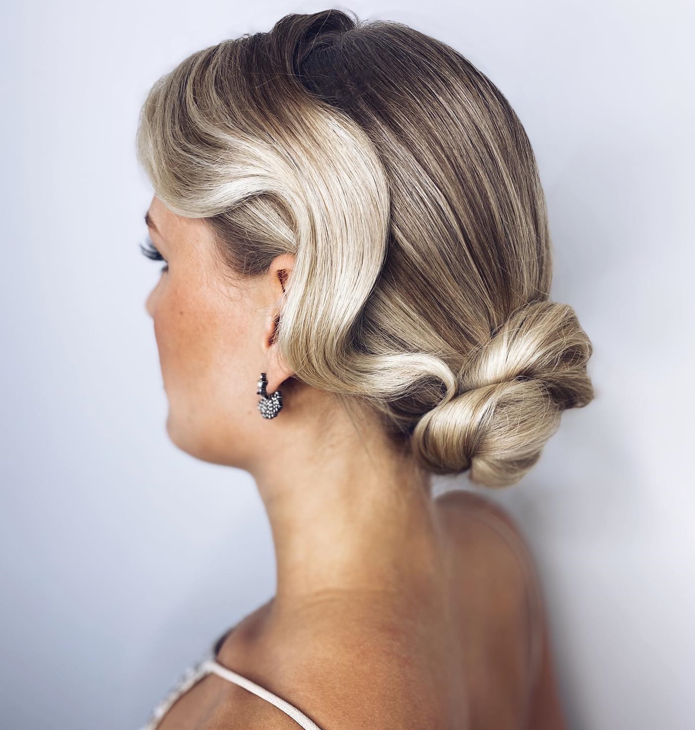Vintage Wedding Hairstyle with Bun and Wavy Side Strand
