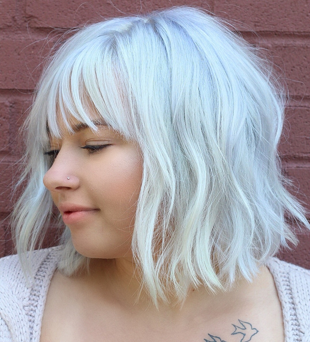 White Razor Cut Bob With Bangs