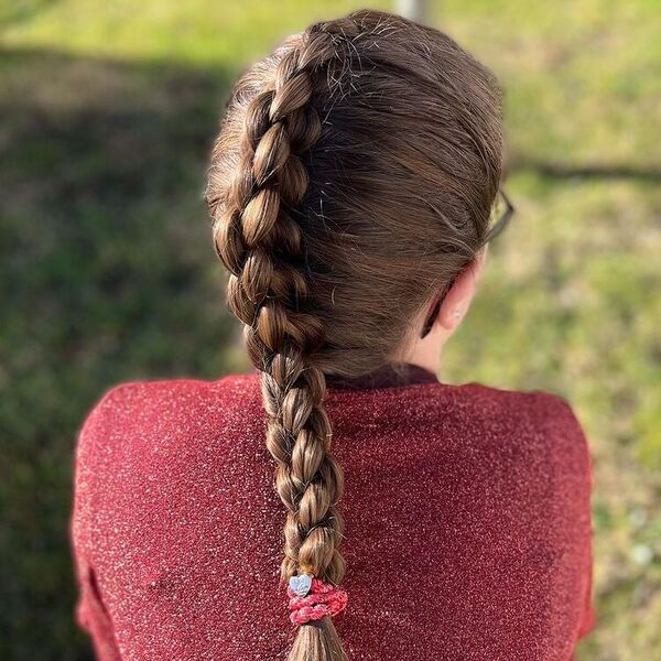 4-Strand Braid Hairstyle - a woman wearing a red long sleeve glittered top