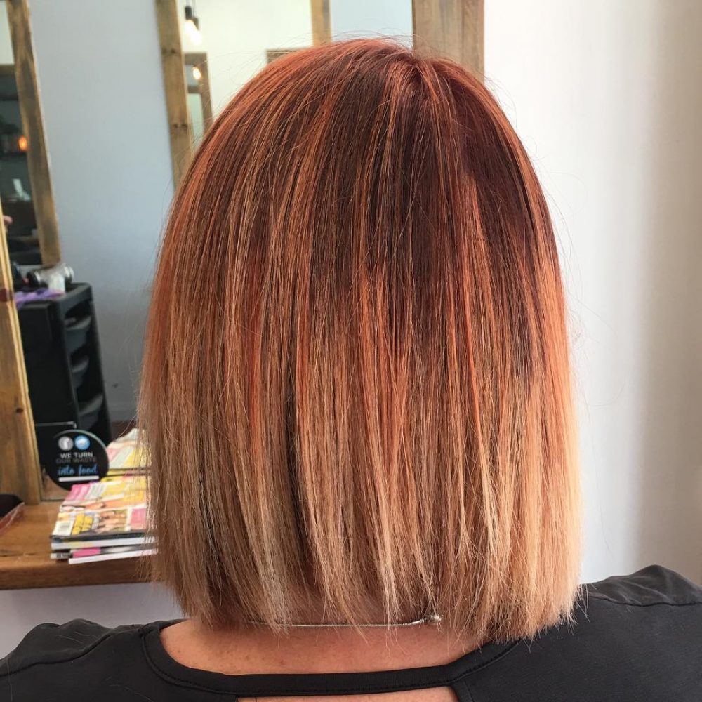 A short Cinnamon Red to Peach Blonde Ombre