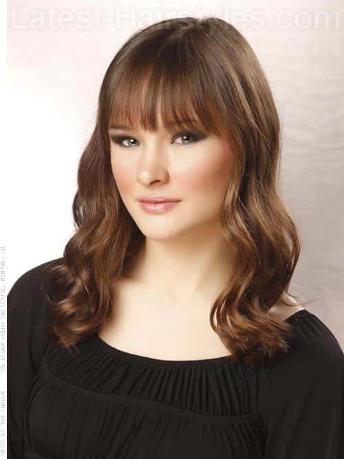 Alluring vintage waves with wispy bangs