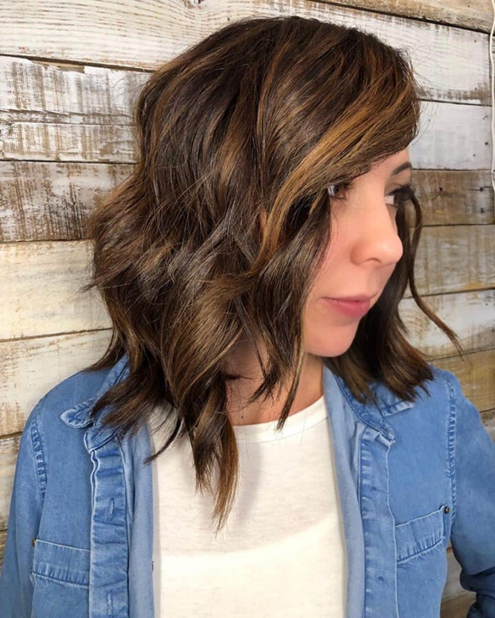 An asymmetrical bob with side bangs