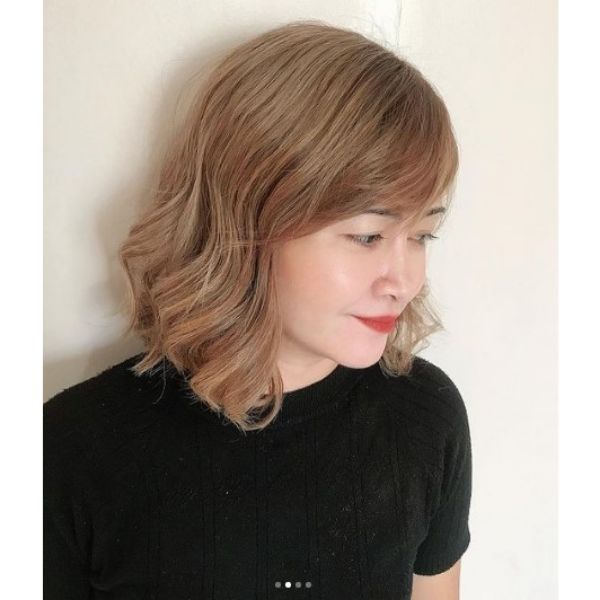Ashy Blonde Medium Haircuts For Wavy Hair with Side Bangs