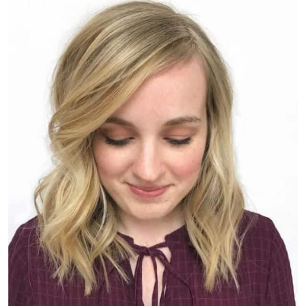 Blonde Medium Haircut with Deep Side Part