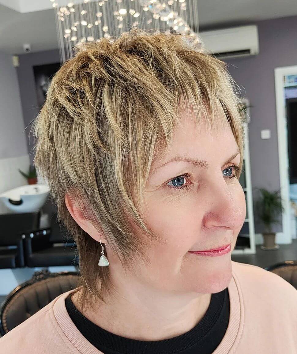blonde shaggy pixie with dark roots