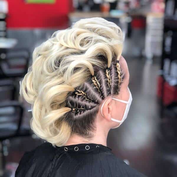 Braided Fauxhawk - a woman in a salon wearing a black cape