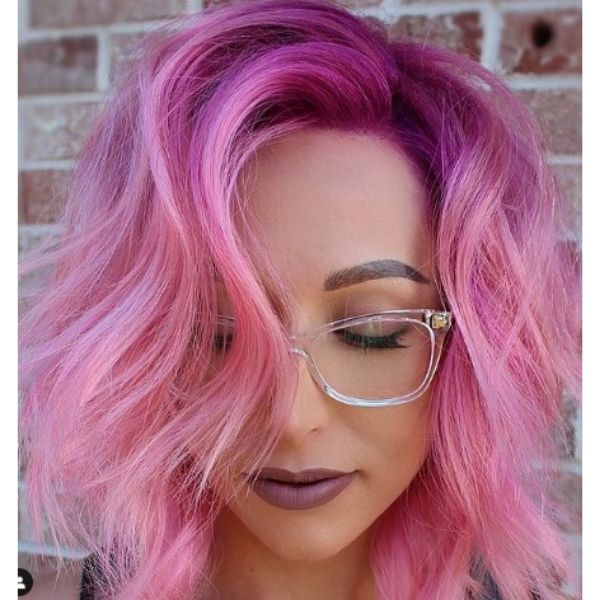 Bright Pink Wavy Haircut With Magenta Roots