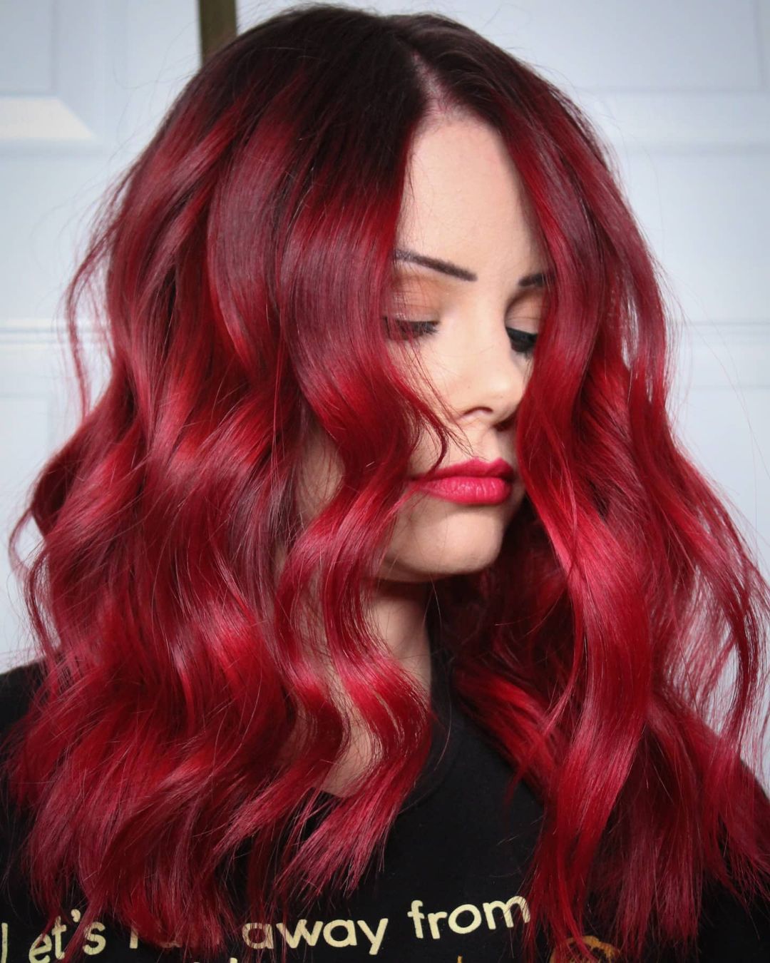 Bright Red Hairstyle with Dark Roots