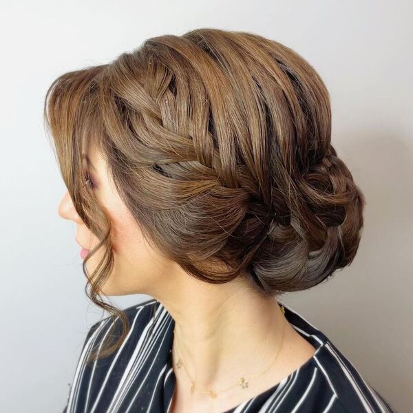 Bun and Braid Hairstyle - a woman wearing a stripe blouse