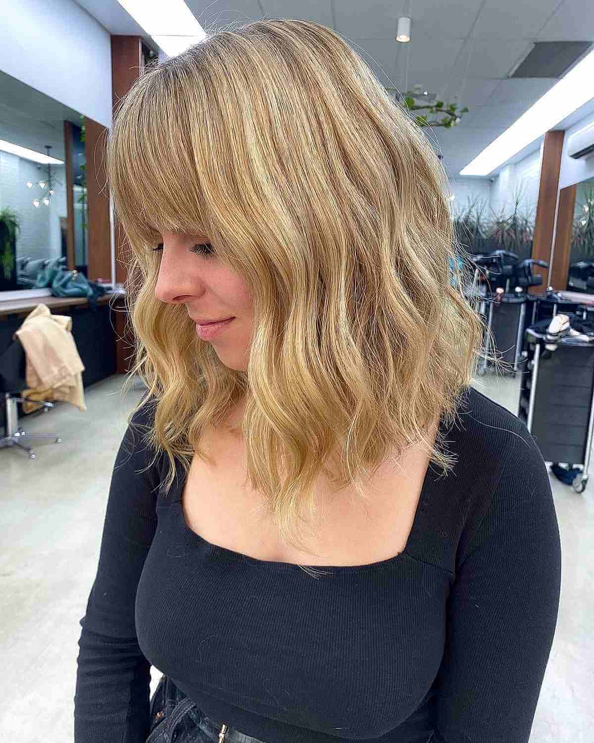Buttery Blonde Wavy Lob with Bangs
