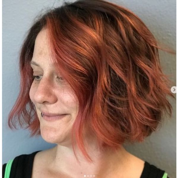 Coral Pink Curly Bob With Side Part