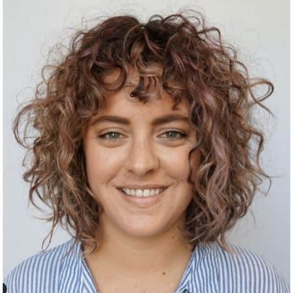 Curly Bob With Pink Highlights And Short Bangs